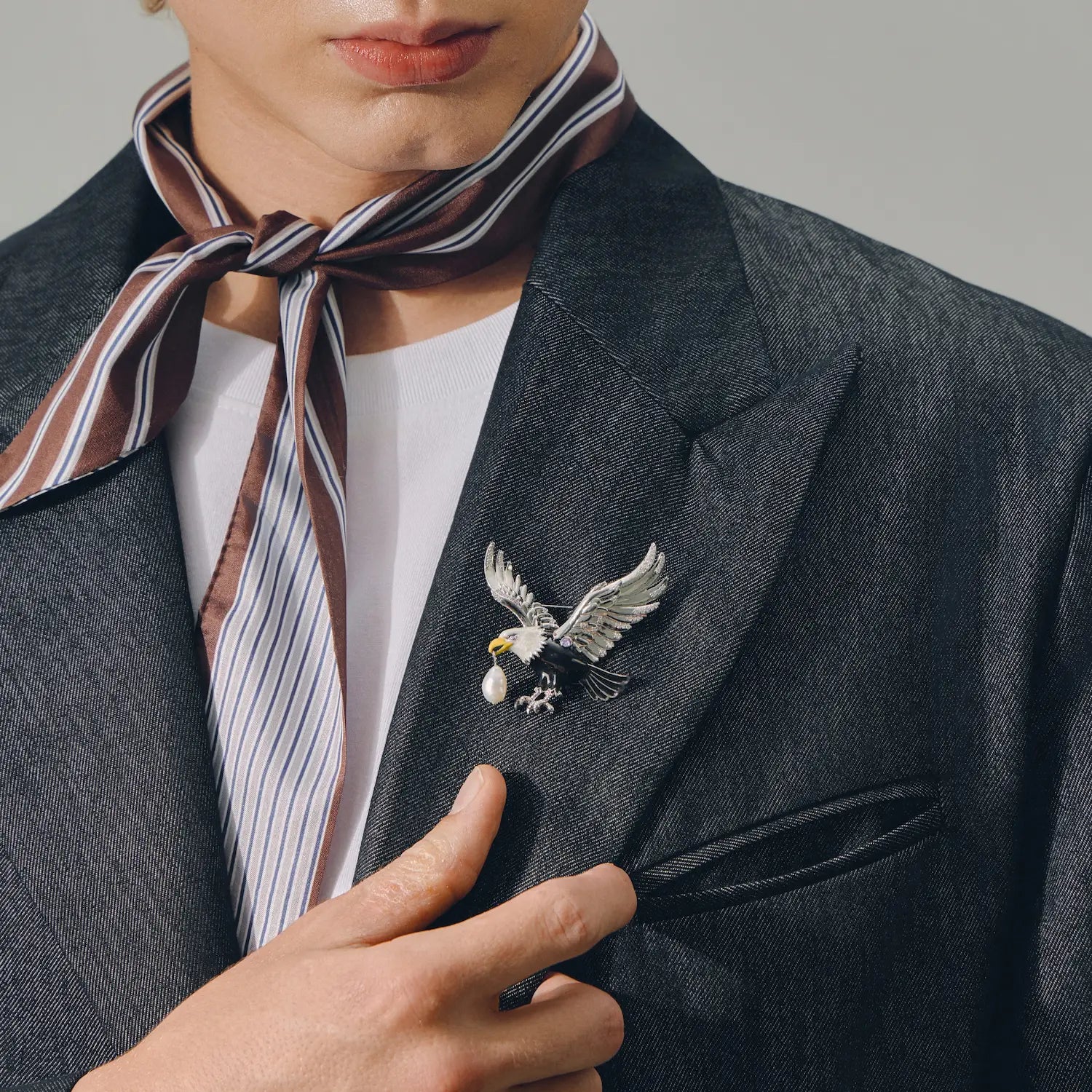 Celestial Eagle brooch styled on a black blazer