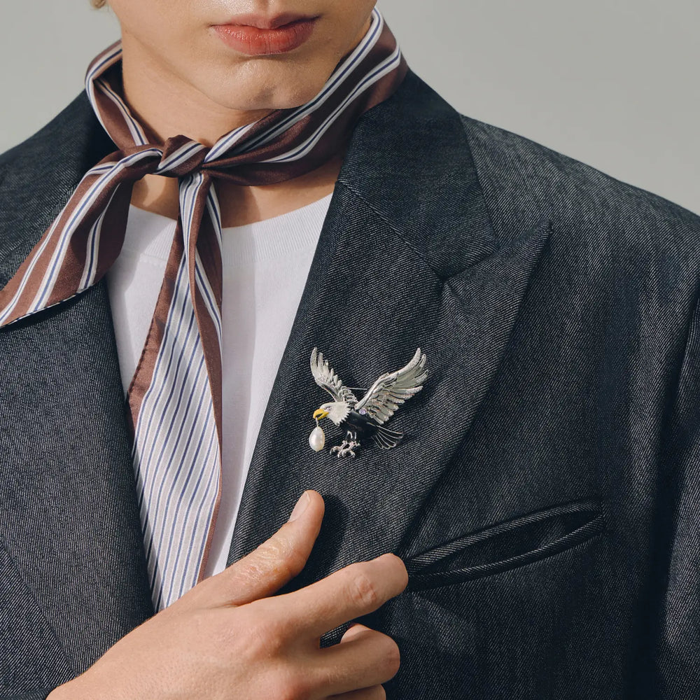 Celestial Eagle brooch styled on a black blazer
